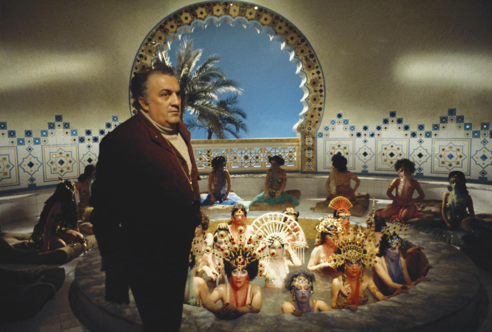 View of Italian film director Federico Fellini (1920 - 1993), along with unidentified cast members, on the set of his film 'Amarcord,' at Cinecitta Studios, Rome, Italy, circa 1973. (Photo by Franco Pinna/Photo Researchers History/Getty Images)