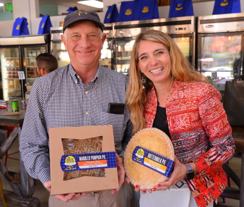 Area restaurants, including Blue Moon Specialty Foods, are busy preparing items for holiday meals to go. Chris "Wishbone" Walker and Molly Cashman show some of the frozen dishes available at the restaurant on Church Street in Spartanburg, November 10, 2021.