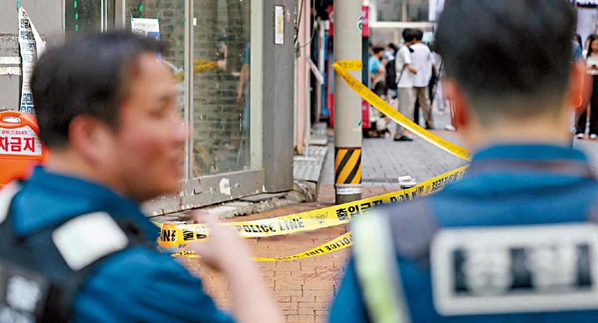 Headline: “Arrest Made in Seoul Beheading Case; Suspect Connected to Hong Kong Murder Search”