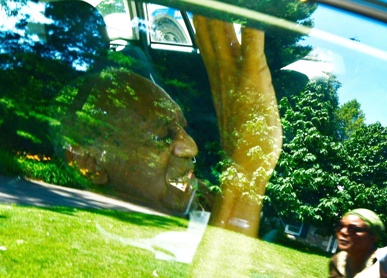 US actor Bill Cosby waves from inside a car as he arrives home after the Pennsylvania Supreme Court threw out Cosby's sexual assault conviction which is expected to result in his release from prison in Elkins Park, Pennsylvania, USA, 30 June 2021 (EPA)