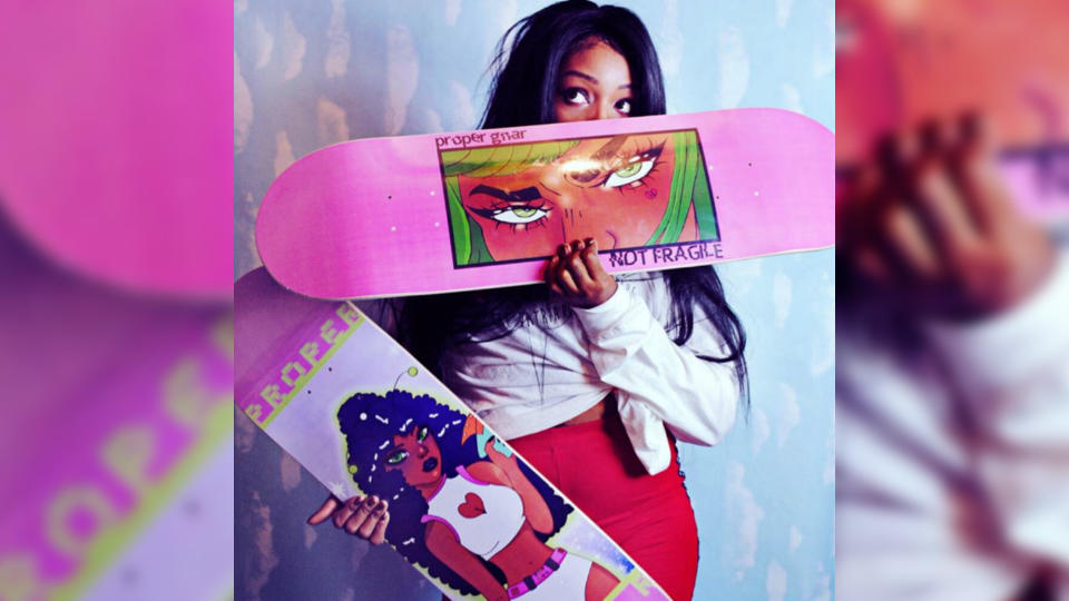 Latosha Stone, owner of Proper Gnar, with a couple of her self-designed skateboards. (Photo courtesy of Latosha Stone)