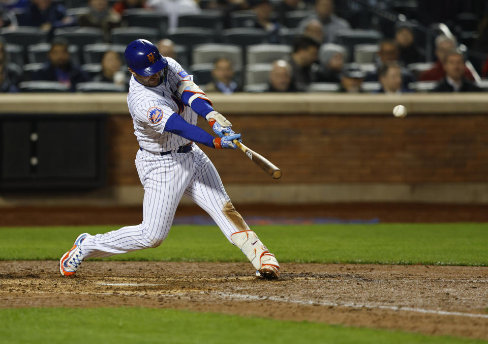 New York Mets' Pete Alonso hits a double against the Washington Nationals during the eighth inning of a baseball game Thursday, April 27, 2023, in New York. (AP Photo/Noah K. Murray)