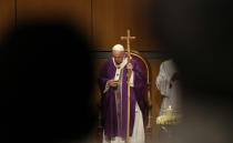 Pope Francis leads a holy mass at "Megaron Concert Hall" in Athens, Greece, Sunday, Dec. 5, 2021. Francis is on a five-day trip to Cyprus and Greece by drawing attention once again to his call for Europe to welcome migrants. (AP Photo/Alessandra Tarantino)