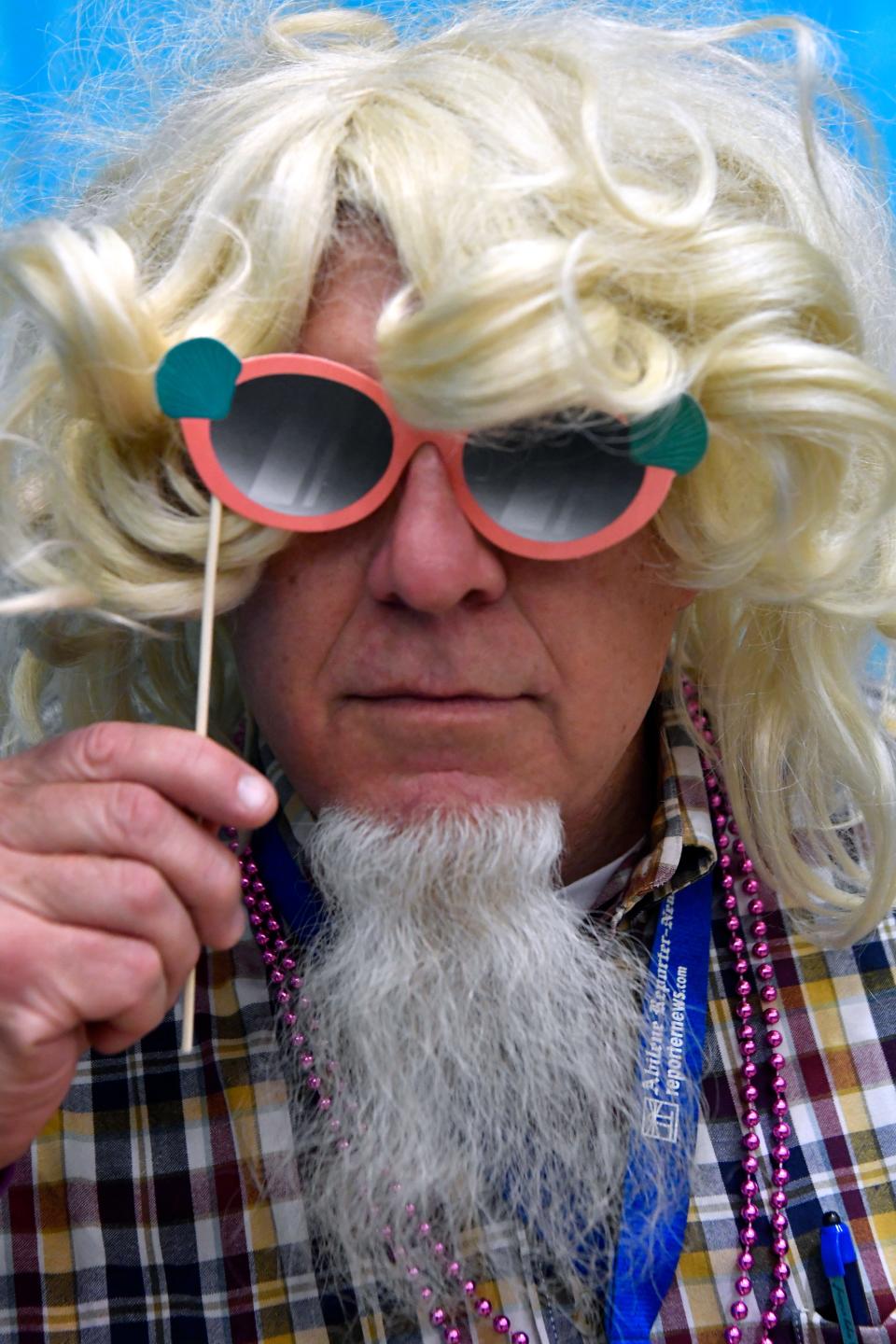 Reporter-News editor Greg Jaklewicz tries on long hair for the first time in the 21st century in 2018 at Bunco for Breast Cancer, held in the Taylor County Coliseum.