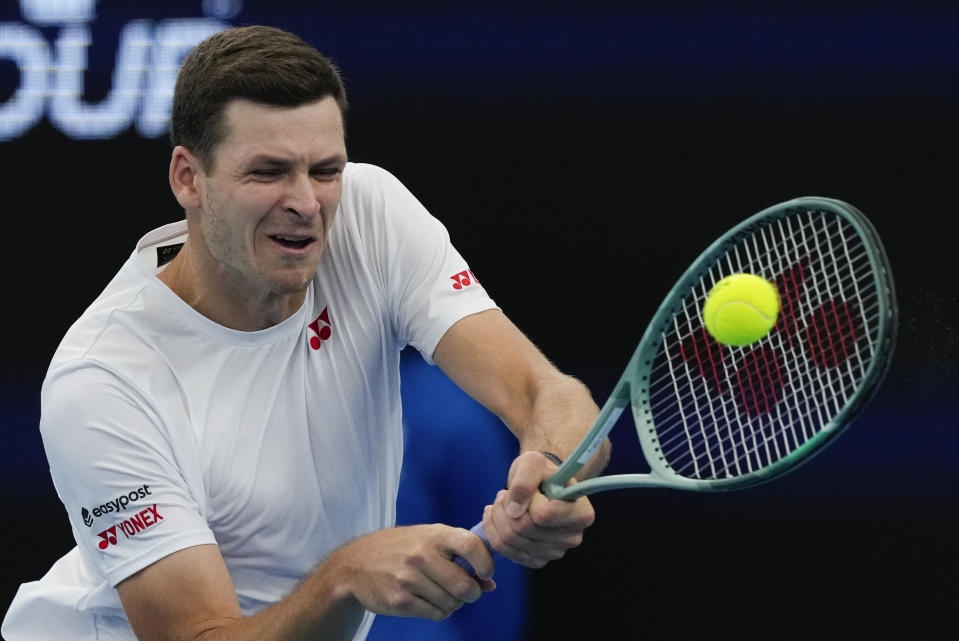 Poland's Hubert Hurkacz plays a backhand return to Adrian Mannarino of France during their United Cup semifinal tennis match in Sydney, Australia, Saturday, Jan. 6, 2024. (AP Photo/Mark Baker)