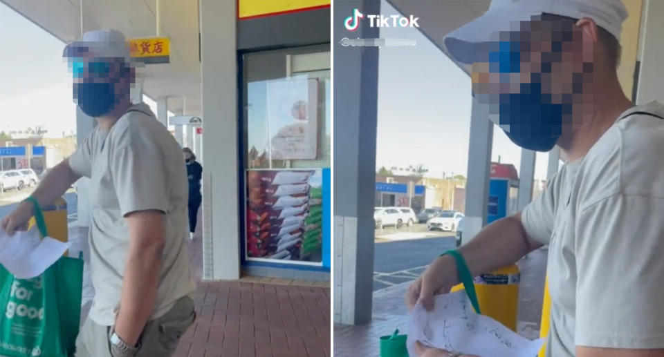 Images of the man folding up a sign he had at the shopping centre.