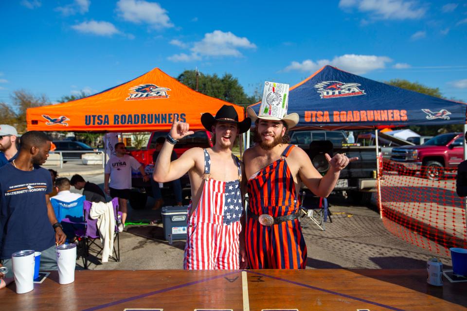 Fans tailgate outside the Alamodome in San Antonio before the Conference USA championship game between Western Kentucky and Texas-San Antonio.