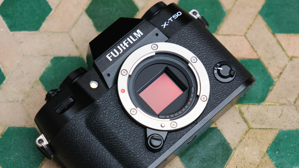 Fujifilm X-T50 camera on a green a white table