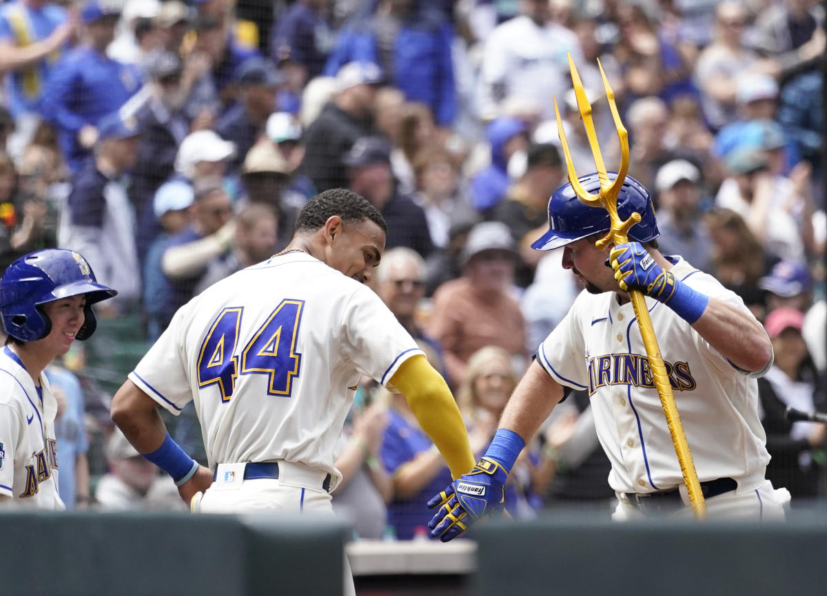 Water drips off of Seattle Mariners' Eugenio Suarez after he was doused by  teammates following his walk-off home run to win the game against the  Pittsburgh Pirates in a baseball game Sunday