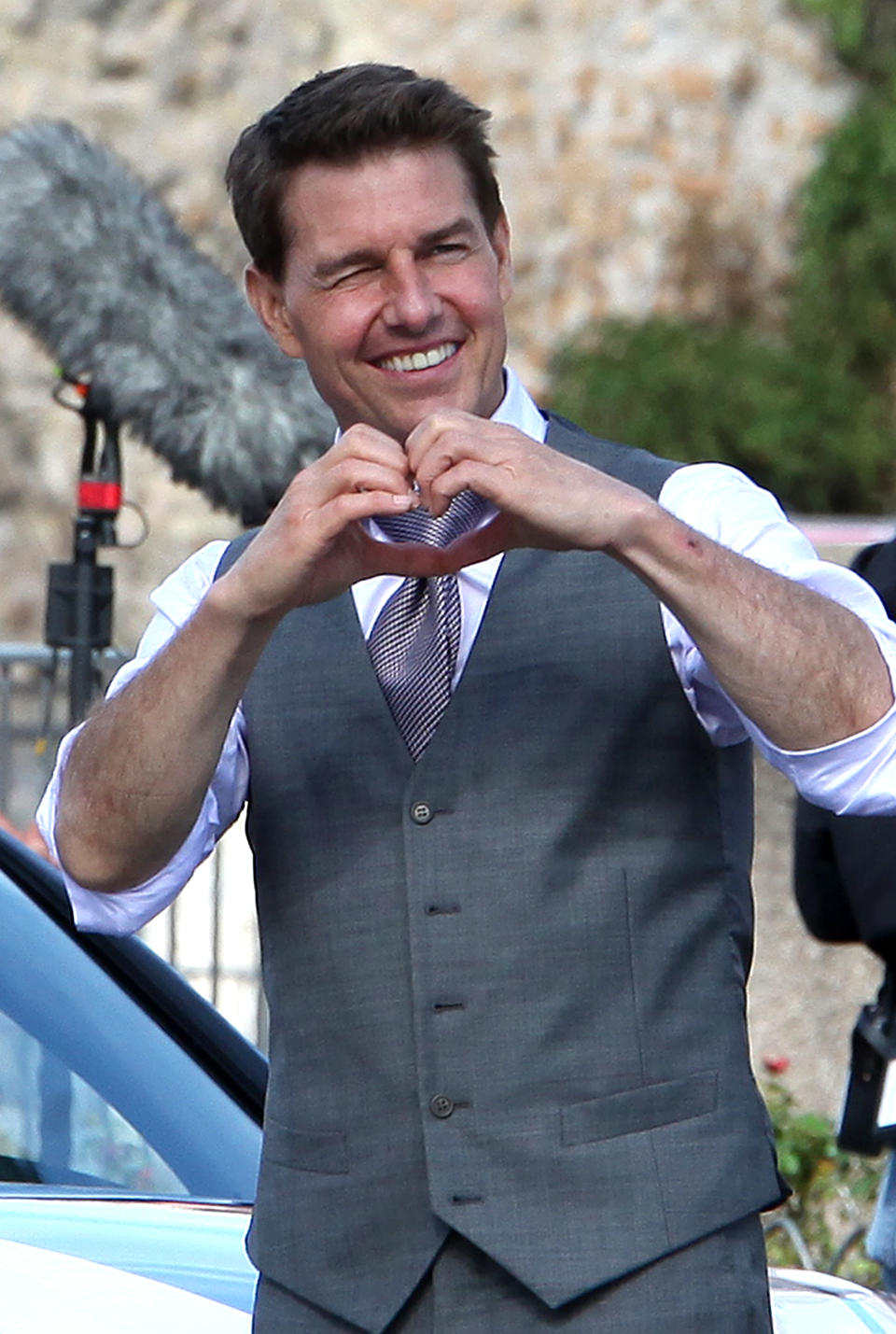 ROME ITALY - OCTOBER 12, 2020 Actor Tom Cruise makes a sign of a heart to fans during a break in the shooting of the film Mission Impossible 7- Lybra. The seventh installment in the Mission Impossible film series is to be released in 2021- PHOTOGRAPH BY Marco Ravagli / Barcroft Studios / Future Publishing (Photo credit should read Marco Ravagli/Barcroft Media via Getty Images)