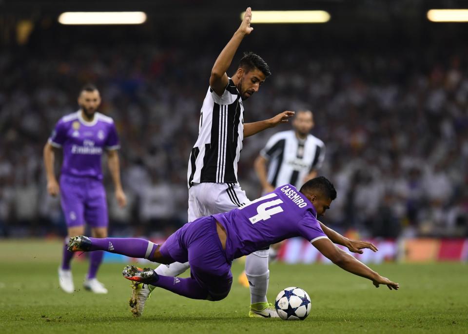 <p>Sami Khedira of Juventus fouls Casemiro of Real Madrid during the UEFA Champions League Final between Juventus and Real Madrid at National Stadium of Wales on June 3, 2017 in Cardiff, Wales </p>