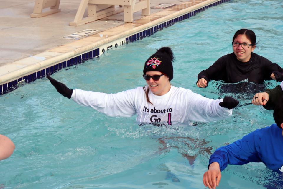 Advo athlete Elizabeth Campbell walks through the pool as she participates in the annual Special Olympics Polar Plunge held at Amarillo Town Club on Hillside Saturday morning.