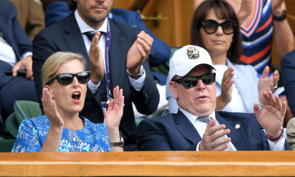 The pair appeared enthralled in match between Roger Federer and Novak Djokovic. Photo: Getty