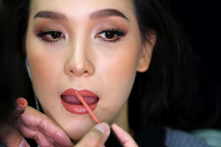 Contestant Jiratchaya Sirimongkolnawin of Thailand prepares backstage before the final show of the Miss International Queen 2016 transgender/transsexual beauty pageant in Pattaya, Thailand, March 10, 2017. REUTERS/Athit Perawongmetha