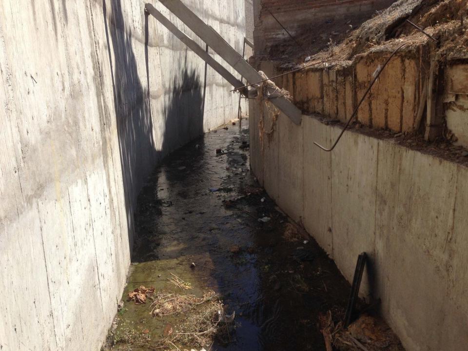 Drug lord Joaquin "El Chapo" Guzman escaped his captors by walking along this drainage canal and tunnel behind a house in Culiacan, Mexico, in February 2014.