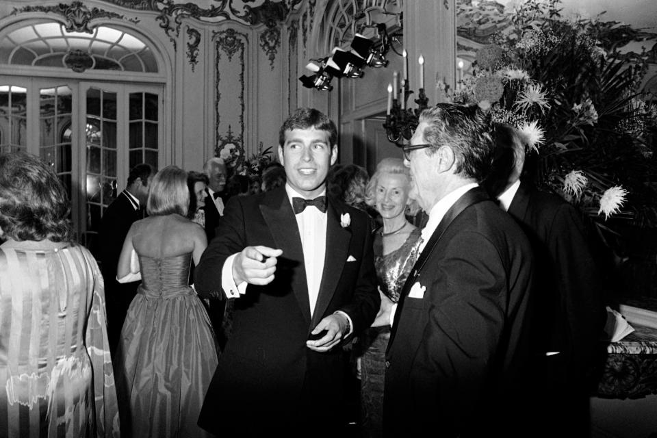 FILE - In this July 16, 1983, file photo, Prince Andrew enters ballroom at Newport Beechwood mansion in Newport, R.I., for gala given by the British America's Cup syndicate. The Prince is spending weekend in Newport sailing and visiting historic places in this seaport city. (AP Photo/Barry Stevens, File)