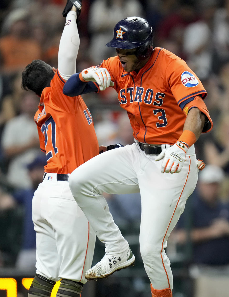 Houston Astros' Jeremy Pena (3) celebrates his three-run home run against the Milwaukee Brewers with Jose Altuve during the fifth inning of a baseball game Friday, May 17, 2024, in Houston. (AP Photo/Eric Christian Smith)