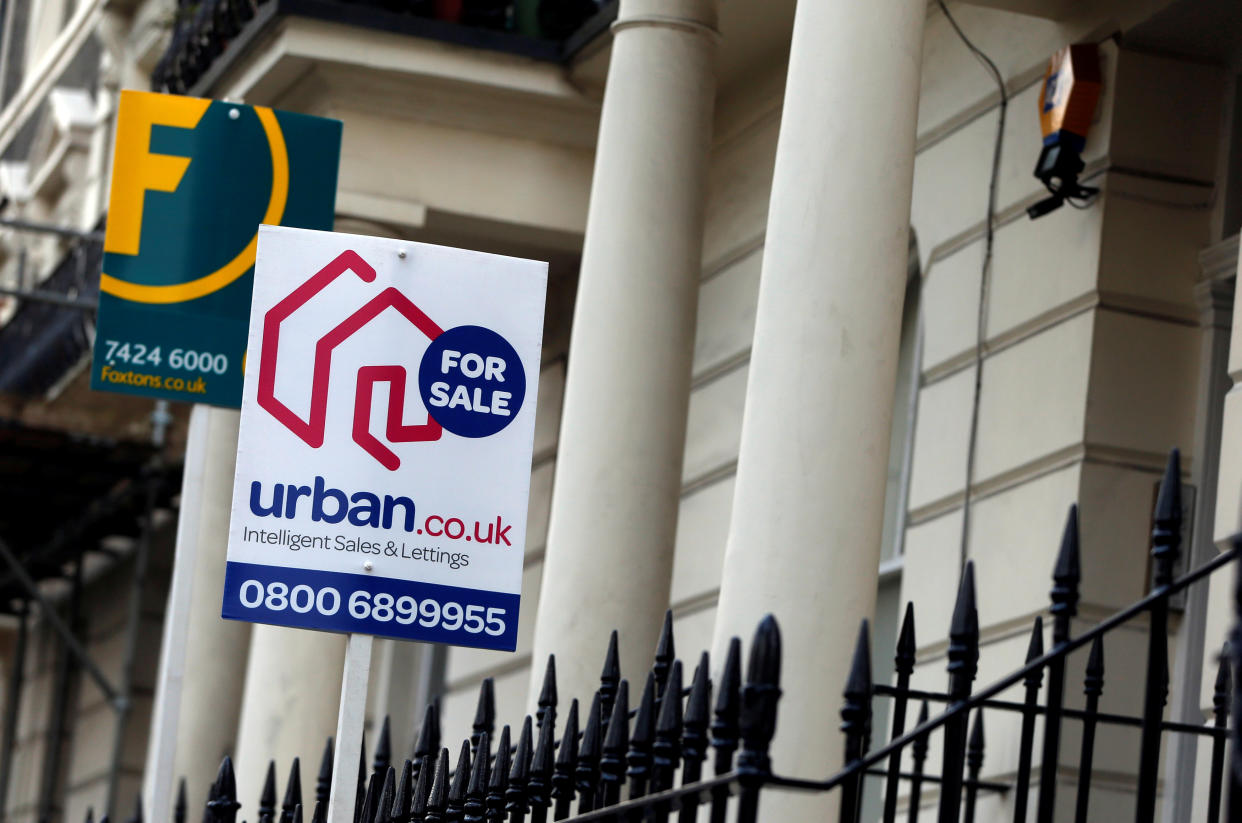 FILE PHOTO: Estate agent signs are displayed outside residential properties in London, Britain January 23, 2016. Photo: REUTERS/Neil Hall/File Photo