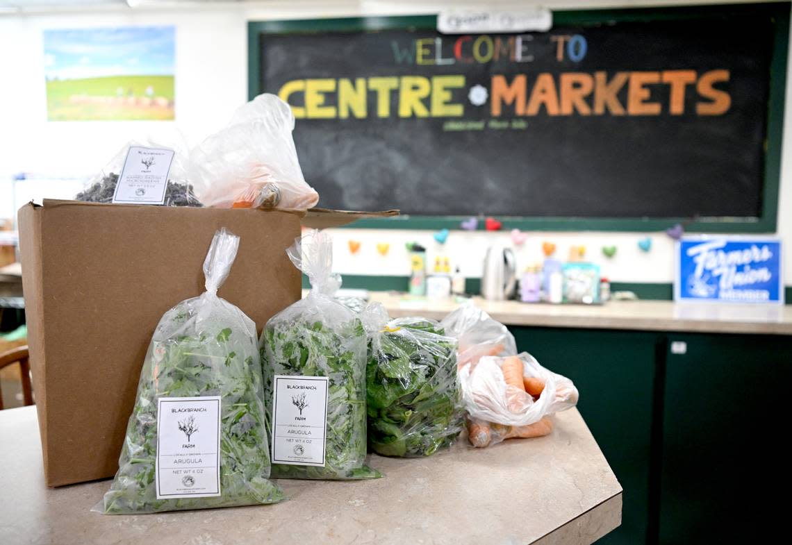 Some fresh greens at carrots at Centre Markets new location in the Nittany Mall on Friday, March 22, 2024.