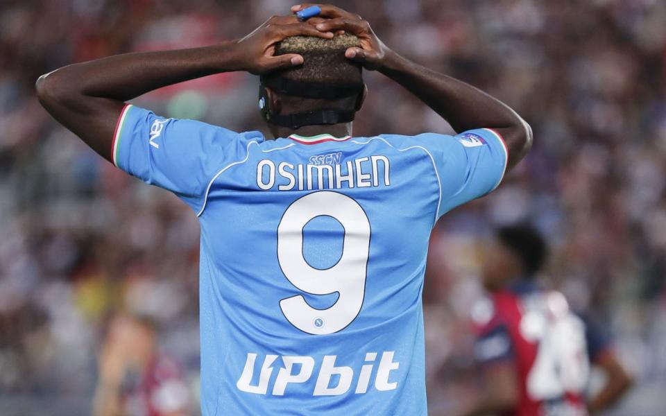 Osimhen holds his head after his penalty miss against Bologna