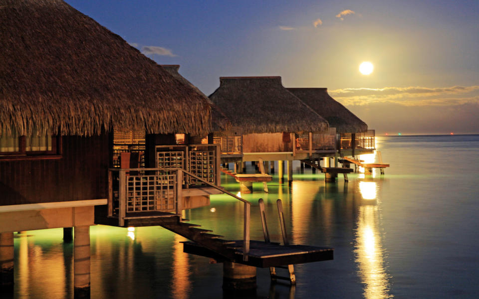 <p>In addition to overwater suites, the <a rel="nofollow noopener" href="http://www3.hilton.com/en/hotels/french-polynesia/hilton-moorea-lagoon-resort-and-spa-PPTMLHI/accommodations/index.html" target="_blank" data-ylk="slk:Hilton Moorea Lagoon Resort;elm:context_link;itc:0;sec:content-canvas" class="link ">Hilton Moorea Lagoon Resort</a> possesses the only overwater bar in French Polynesia. If you can pry yourself away from the water views, request a guided tour of the heart-shaped island, and take full advantage of the resort's vacation planners. They'll help you plan your trip in detail before you arrive (think: swimming with stingrays and 4x4 safari tours).</p>