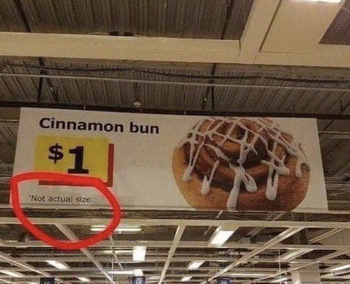 Store sign advertising a cinnamon bun for $1 with the note 