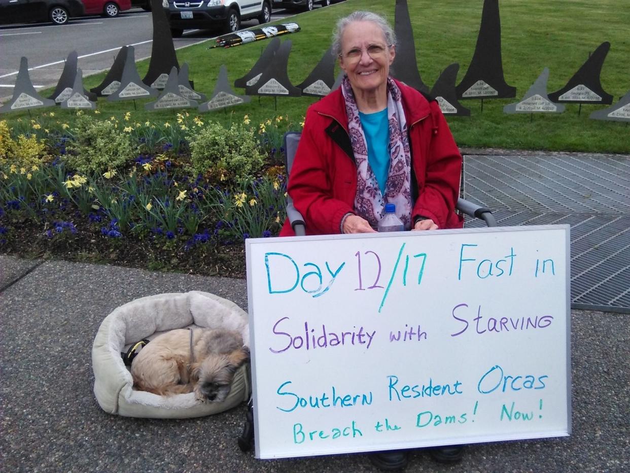 71-year-old Lanni Johnson protested outside the Washington state capitol building to raise awareness about starving orcas. (Credit: Lanni Johnson)