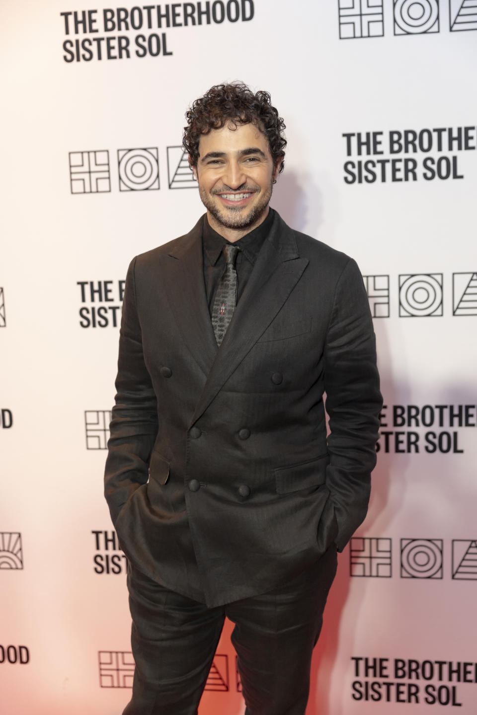 Zac Posen at The Brotherhood Sister Sol event, wearing a double-breasted suit