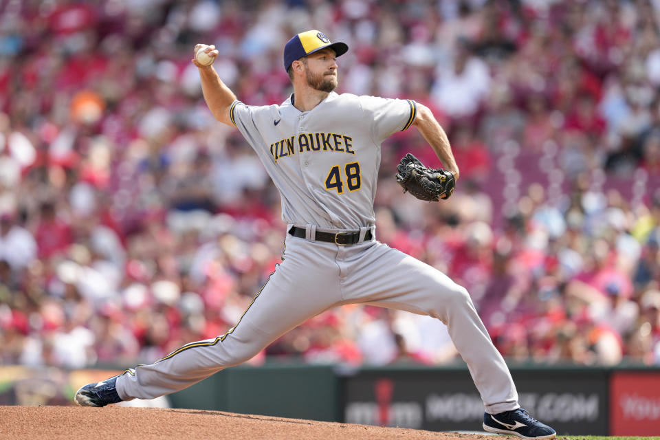 Milwaukee Brewers starting pitcher Colin Rea throws against the Cincinnati Reds in the first inning of a baseball game in Cincinnati, Saturday, June 3, 2023. (AP Photo/Jeff Dean)