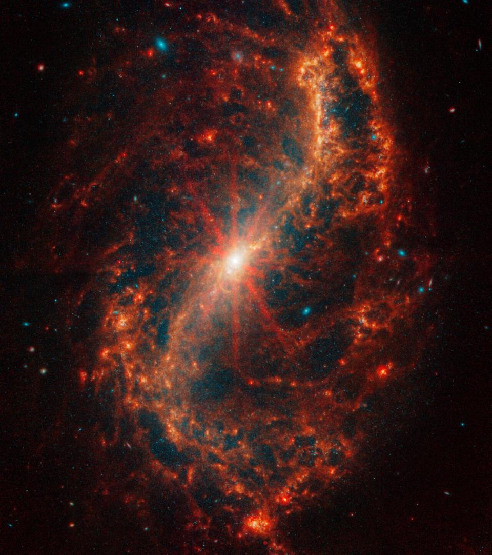 Older blue stars punch through NGC 7496's orange gas