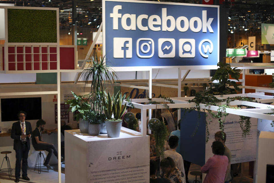 FILE - In this June 16, 2017 file photo, the Facebook booth is seen at the Vivatech, a gadgets show in Paris, France. France has adopted a pioneering tax on internet giants like Google, Amazon and Facebook despite threats from the U.S. Just ahead of the vote Thursday, French economy minister Bruno Le Maire said allies needed to settle differences "without using threats." (AP Photo/Thibault Camus, File)