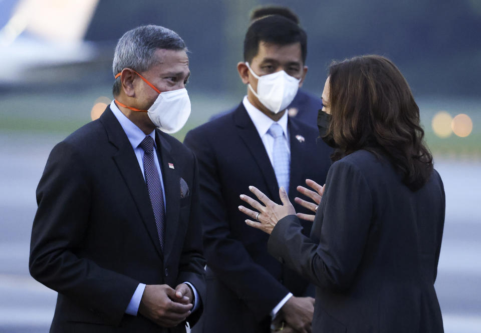 U.S. Vice President Kamala Harris speaks with Singapore's Foreign Minister Vivian Balakrishnan as she departs Singapore for Vietnam, Tuesday, Aug. 24, 2021. (Evelyn Hockstein/Pool Photo via AP)