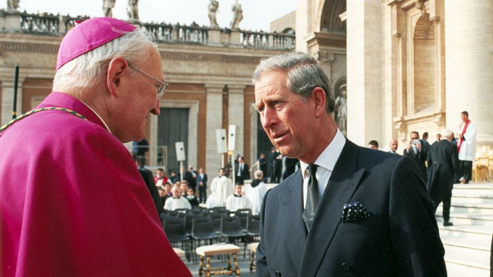 American Archbishop James Harvey, head of papal protocol, shakes hands with King Charles prior to Pope John Paul II's funeral