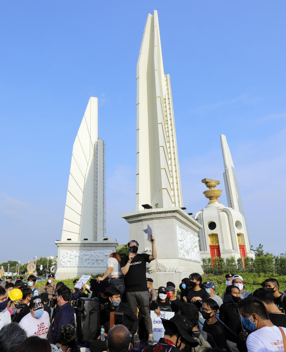 Thai anti-government protesters gather front of the Democracy Monument in Bangkok, Thailand, Saturday, July 18, 2020. Several thousand anti-government protesters have rallied in the Thai capital Bangkok to call for a new constitution, new elections and an end to repressive laws. (AP Photo/Nathathida Adireksarn)