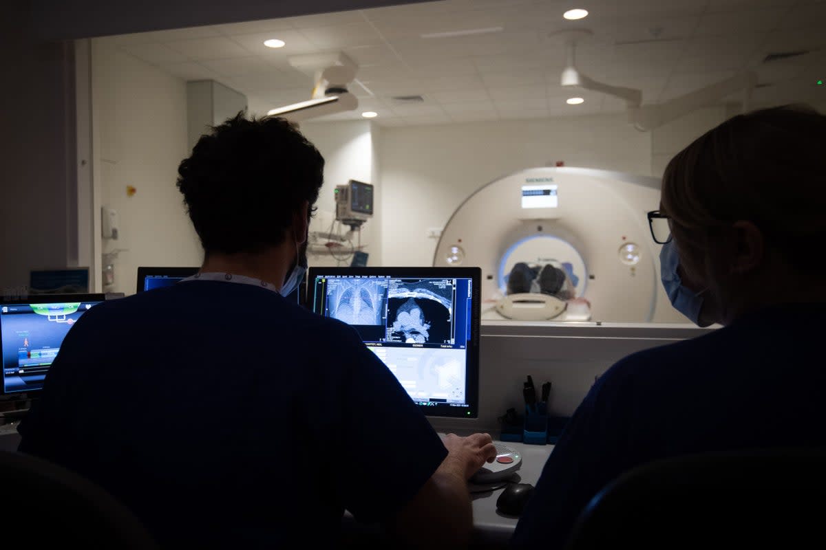 A suspected cancer patient receives a CT scan (File picture) (PA Archive)