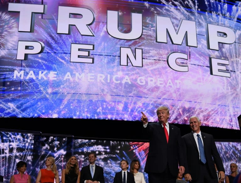 Donald Trump and Mike Pence gesture to the audience after they accepted the party nomination on the last day of the Republican National Convention