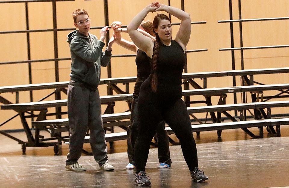 Senior Rachel Robison (center) rehearses with Ashland High School's Sing & Swing.