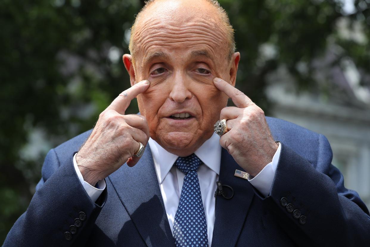 <p>File: Rudy Giuliani talking to journalists outside the White House West Wing on 1 July 2020 </p> (Getty Images)