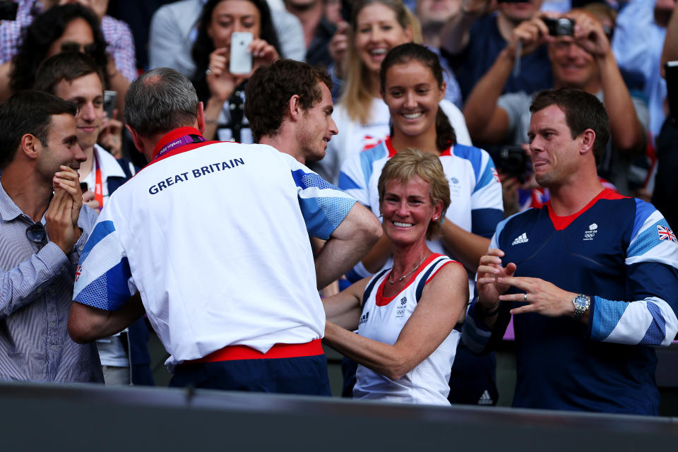 Andy Murray of Great Britain (C) celebrates with his mother Judy Murray (2R), Team Leader Paul Hutchins (L), Davis Cup captian Leon Smith (R) and Laura Robson (Top) after defeating Roger Federer of Switzerland in the Men's Singles Tennis Gold Medal Match on Day 9 of the London 2012 Olympic Games at the All England Lawn Tennis and Croquet Club on August 5, 2012 in London, England. Murray defeated Federer in the gold medal match in straight sets 2-6, 1-6, 4-6. (Photo by Clive Brunskill/Getty Images)
