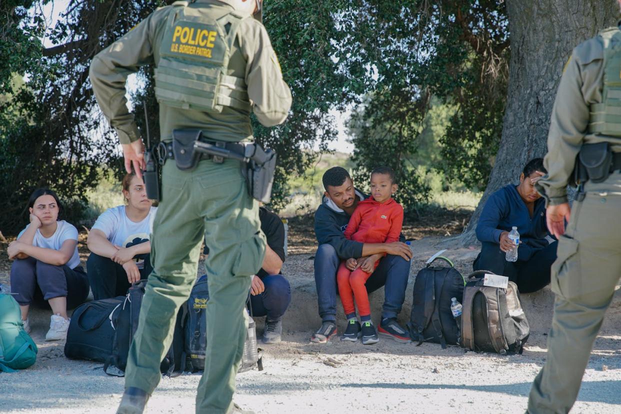 Undocumented migrants in Jacumba, Calif., are detained by U.S. Border Patrol officers on June 4, 2024. <a href="https://www.gettyimages.com/detail/news-photo/irregular-migrants-camping-in-the-border-area-of-jacumba-news-photo/2155490085?adppopup=true" rel="nofollow noopener" target="_blank" data-ylk="slk:Katie McTiernan/Anadolu via Getty Images;elm:context_link;itc:0;sec:content-canvas" class="link ">Katie McTiernan/Anadolu via Getty Images</a>
