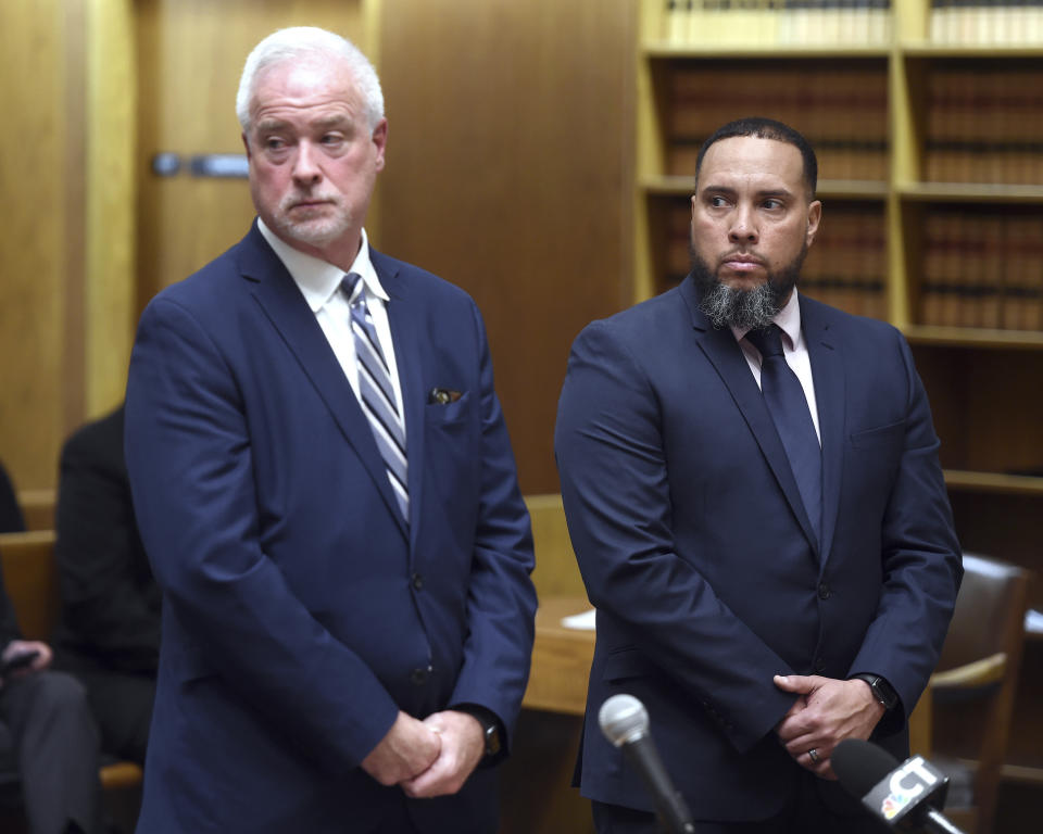 Former New Haven Police Officer Luis Rivera, right, appears in Superior Court in New Haven, Conn., on Thursday, March 28, 2024, with attorney Raymond Hassett seeking accelerated rehabilitation for two charges related to the incident that left Richard "Randy" Cox paralyzed. The former New Haven officers' applications for a pretrial probation program were rejected Thursday in the case of Cox. (Arnold Gold/Hearst Connecticut Media via AP, Pool)