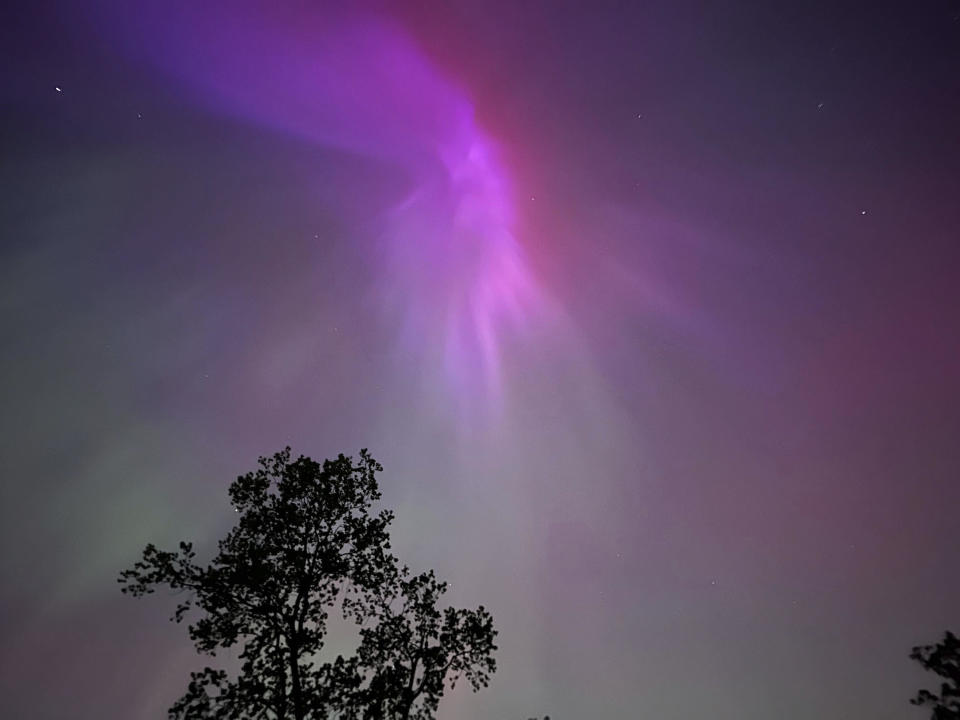 Aurora Borealis, also known as the Northern Lights, can be seen over Ann Arbor, Michigan on Saturday, May 11, 2024.  / Credit: Dee-Ann Durbin / AP