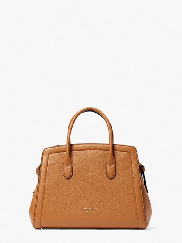 <p>Kate Spade New York Knott Medium Satchel, $348, <a href="https://rstyle.me/+9lc3c1Ce2IJ7855VlB4xPg" rel="nofollow noopener" target="_blank" data-ylk="slk:available here;elm:context_link;itc:0;sec:content-canvas" class="link ">available here</a>.</p>