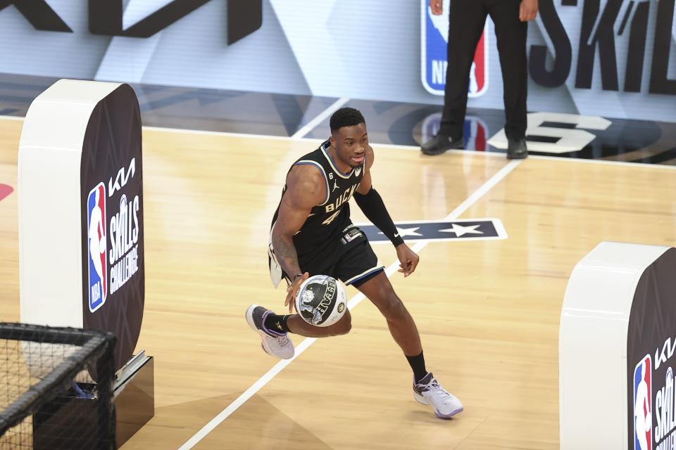 Thanasis Antetokounmpo of the Milwaukee Bucks dribbles during the skills challenge of the NBA basketball All-Star weekend Saturday, Feb. 18, 2023, in Salt Lake City. (AP Photo/Rob Gray)