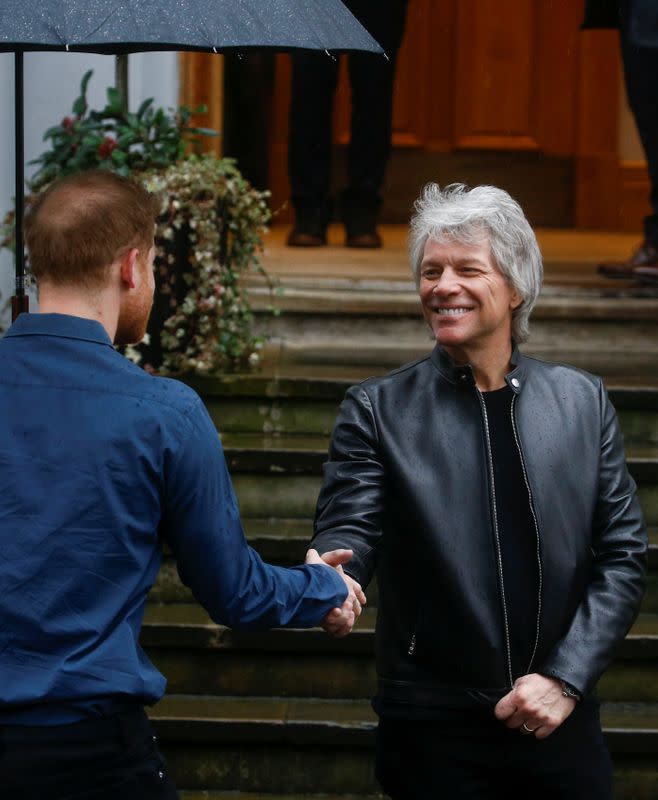 Britain's Prince Harry meets Jon Bon Jovi and members of the Invictus Games Choir in London