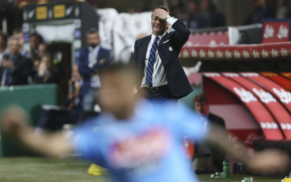 Inter Milan coach Walter Mazzarri touches his head reacting during a Serie A soccer match between Inter Milan and Napoli, at the San Siro stadium in Milan, Italy, Saturday, April 26, 2014. (AP Photo/Luca Bruno)