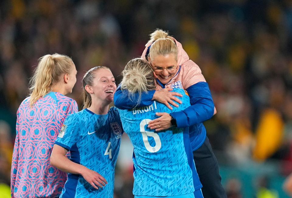 England coach Sarina Wiegman hugs player Millie Bright after their FIFA Women's World Cup semifinal victory over Australia this week. England will meet Spain on Sunday for the championship. Wiegman and Texas soccer coach Angela Kelly were college teammates.