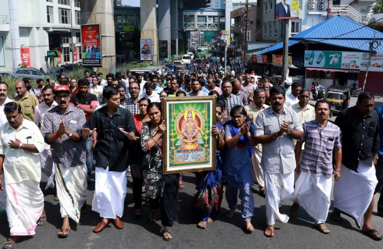 Protests broke out after police escorted two women into a controversial temple in Southern India