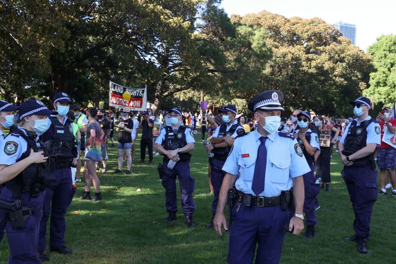 Police are seen as protesters gather on Australia Day in Sydney
