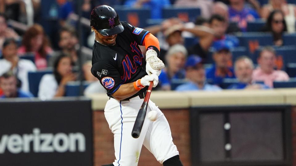 New York Mets shortstop Francisco Lindor (12) hits a two-run home run against the Atlanta Braves during the third inning at Citi Field